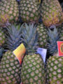 Pineapple fruit on display at a supermarket.
