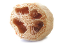 A luffa sponge whose coarse texture helps with skin polishing.