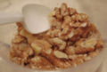 Shelled walnuts in a cup